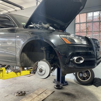 An SUV on the lift for brake and wheel service